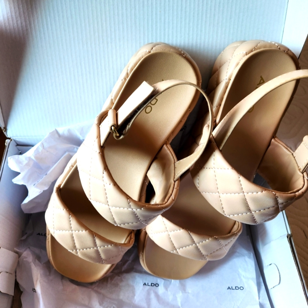 Brand new "Cossette" in box platform sandals